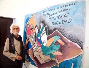 Eminent painter M.F. Hussain with his painting 'Thief of Baghdad' poses for photographers